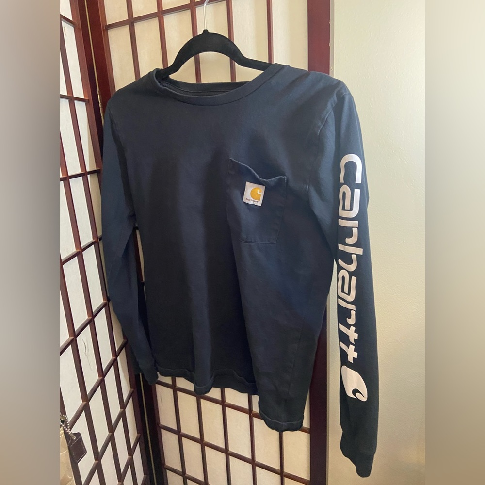 Carhartt black long sleeve spell out on sleeve. No letter cracking. Kids size L